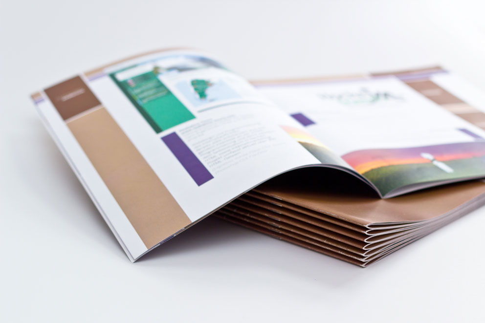 Stack of open brochures, representing guidance on communication standards and practices.